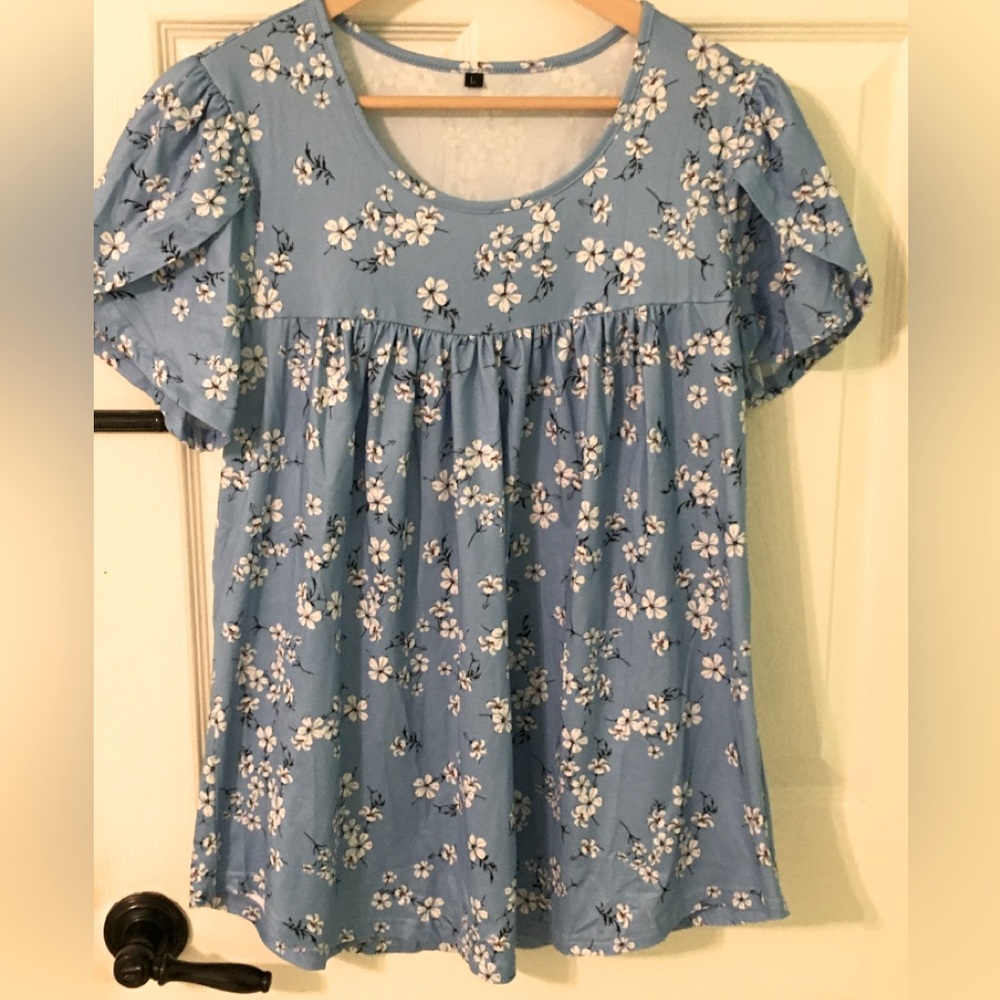 Light blue and white floral blouse.
